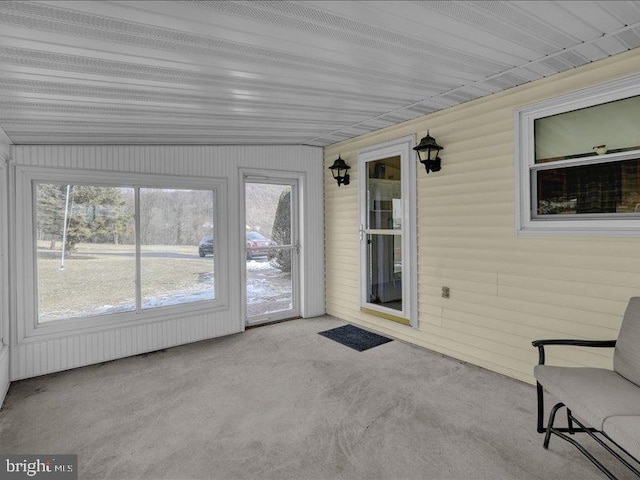 unfurnished sunroom featuring a healthy amount of sunlight