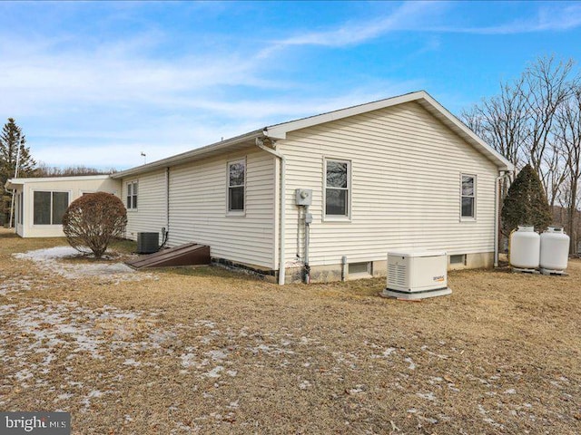 view of property exterior with central AC unit