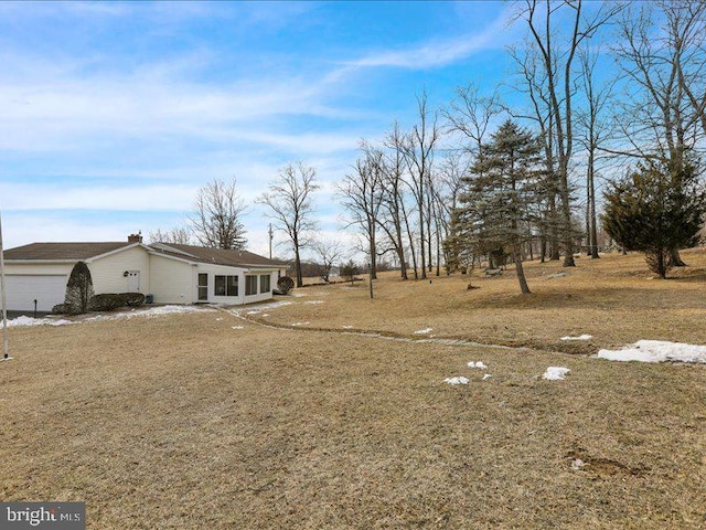 view of yard featuring a garage