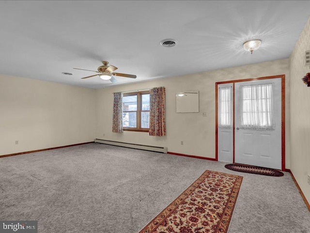 carpeted foyer featuring a ceiling fan, a baseboard radiator, visible vents, and baseboards