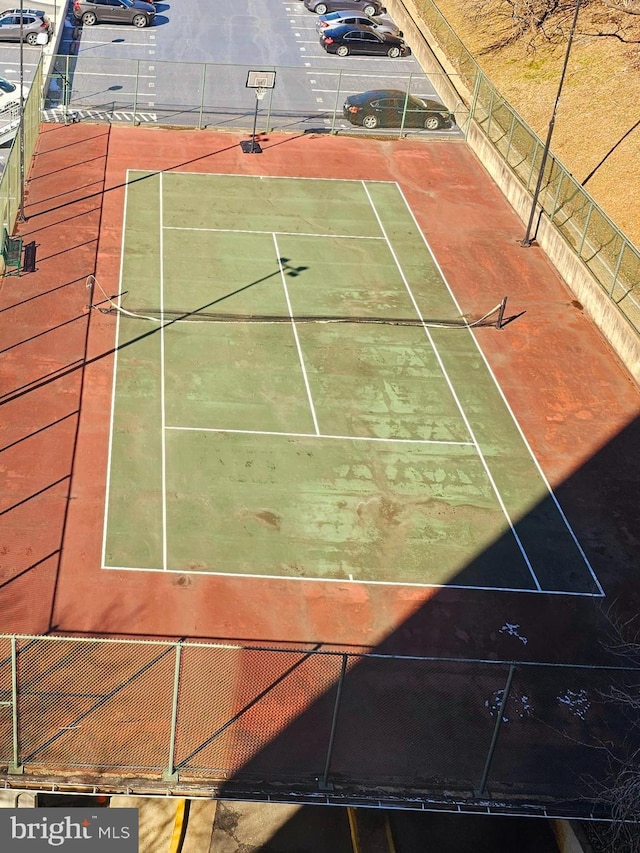 view of sport court with basketball hoop