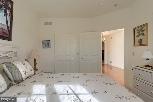 bedroom with light hardwood / wood-style flooring