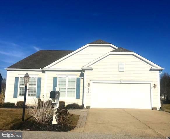 single story home featuring driveway and an attached garage