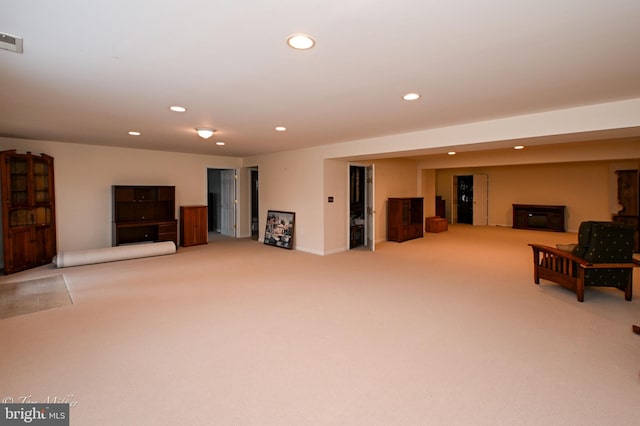 sitting room featuring recessed lighting, light carpet, and visible vents