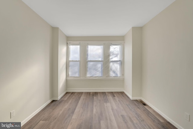 empty room with light wood-type flooring