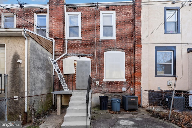 back of house featuring central air condition unit