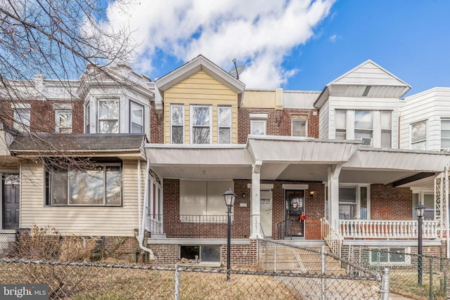 multi unit property featuring a porch