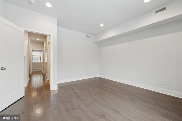 empty room featuring wood-type flooring