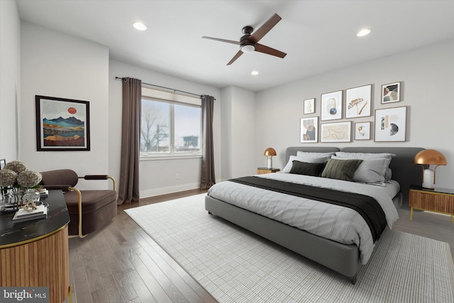 bedroom with wood-type flooring and ceiling fan