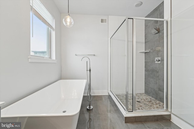 bathroom with shower with separate bathtub