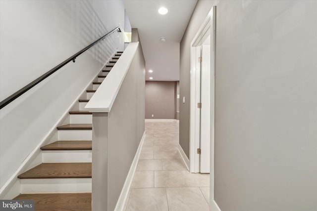 stairs with tile patterned floors