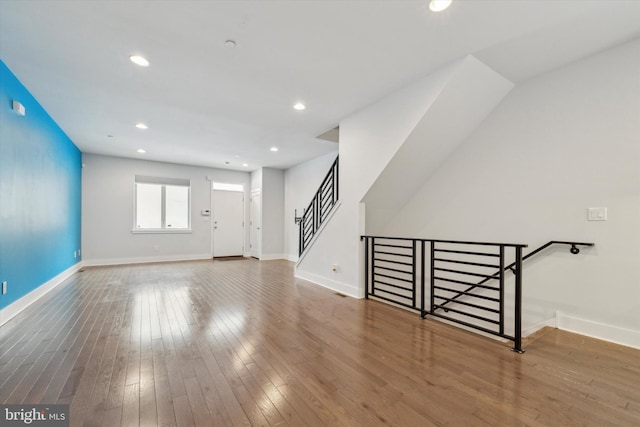 unfurnished living room with hardwood / wood-style flooring