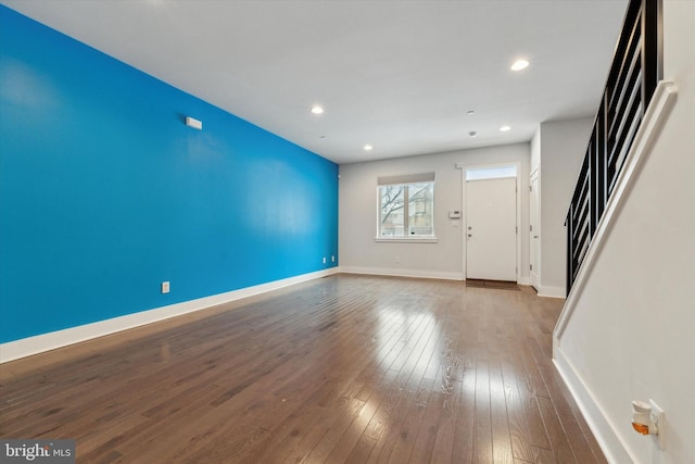 unfurnished living room with hardwood / wood-style flooring