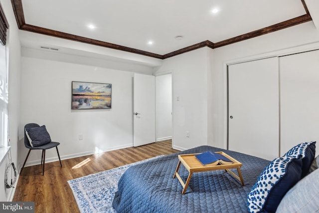 bedroom featuring baseboards, visible vents, ornamental molding, and dark wood-type flooring