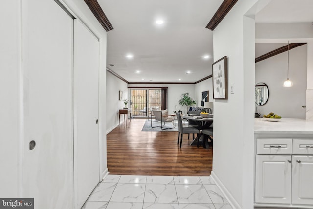 foyer entrance featuring marble finish floor, baseboards, crown molding, and recessed lighting