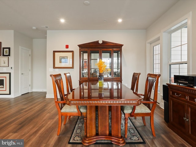 dining area with dark wood-type flooring