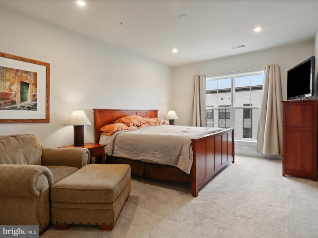 bedroom with light carpet