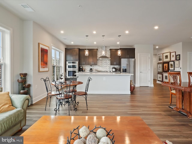 dining space with light wood-type flooring