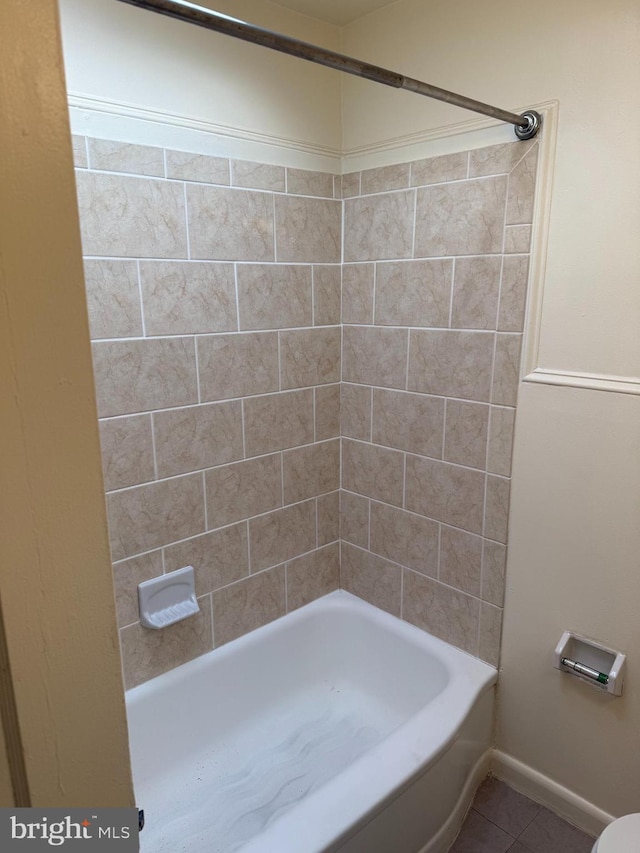 full bath featuring  shower combination and tile patterned flooring