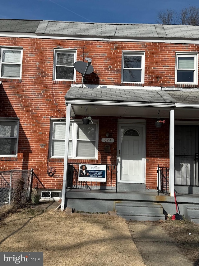 townhome / multi-family property with brick siding