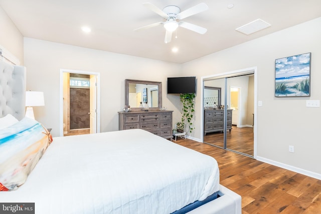 bedroom featuring ceiling fan, recessed lighting, wood finished floors, baseboards, and a closet