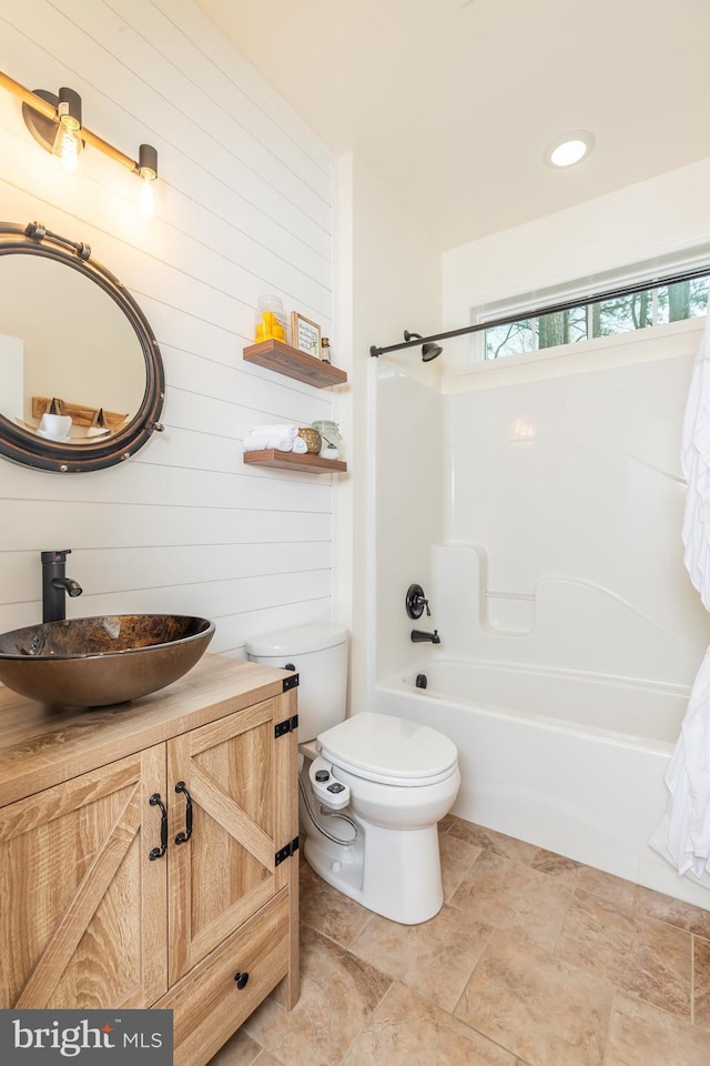 full bath with toilet, shower / bathtub combination, and vanity