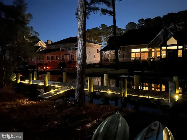 view of back of house at twilight