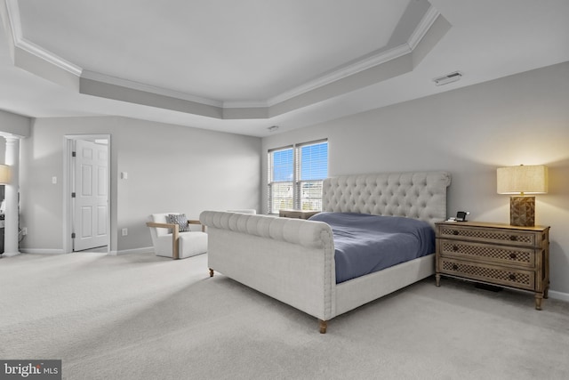 bedroom with carpet, a raised ceiling, visible vents, and crown molding