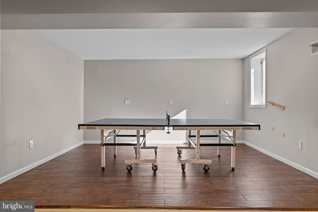 playroom featuring baseboards and wood finished floors