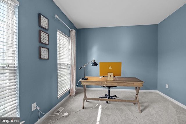 office space with carpet floors, visible vents, and baseboards