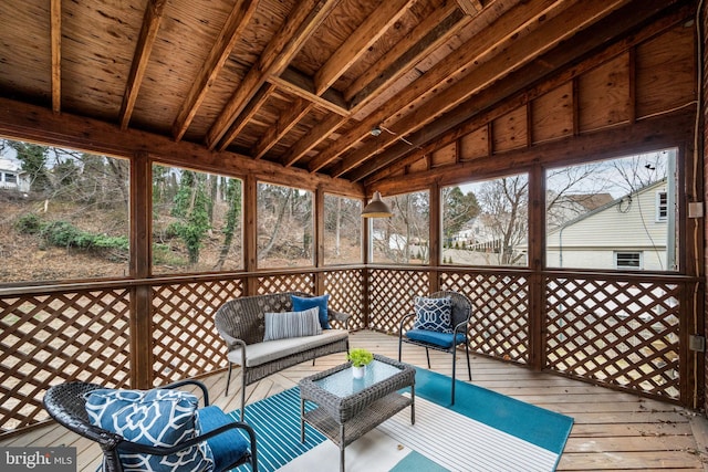 unfurnished sunroom featuring wooden ceiling and vaulted ceiling