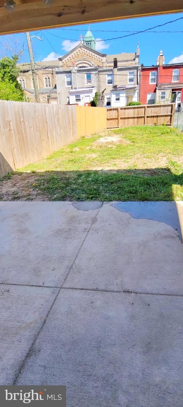 exterior space with fence and a patio