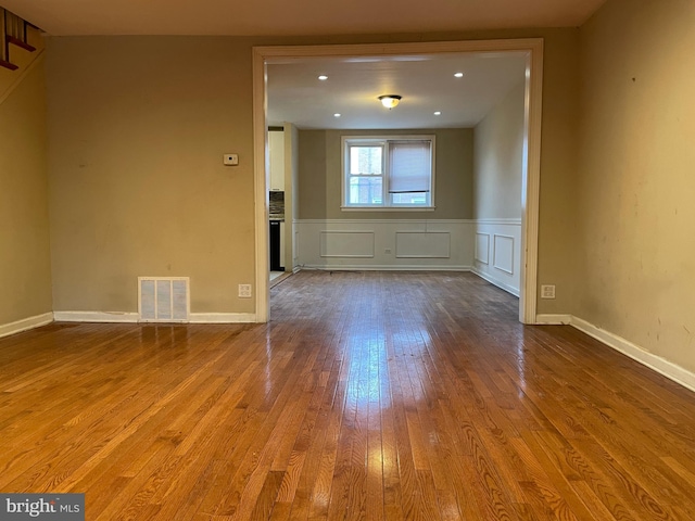 spare room with wood-type flooring