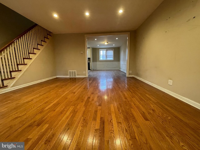 unfurnished living room with hardwood / wood-style floors