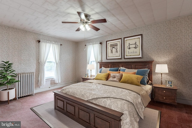 bedroom featuring radiator heating unit, ceiling fan, and carpet