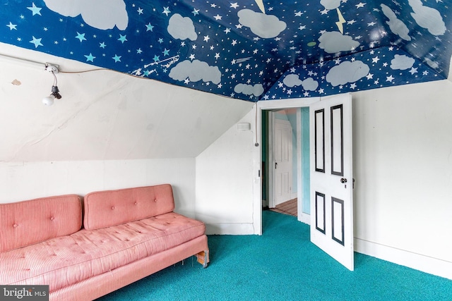 living area featuring lofted ceiling and carpet