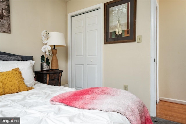 2202 228th St, Pasadena, MD 21122 - bedroom featuring a closet, wood finished floors, and baseboards