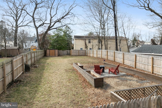 view of yard with a patio area and a storage shed