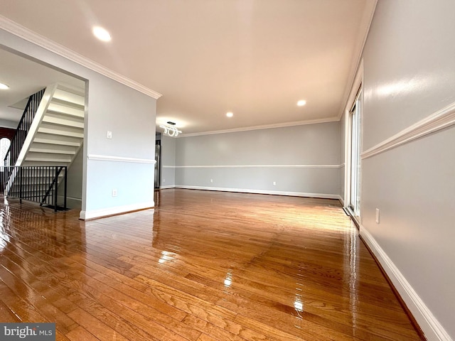 unfurnished room with baseboards, recessed lighting, wood-type flooring, and crown molding