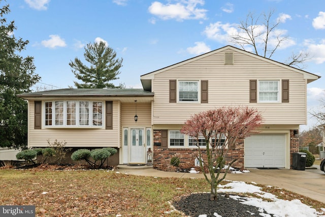 split level home featuring a garage