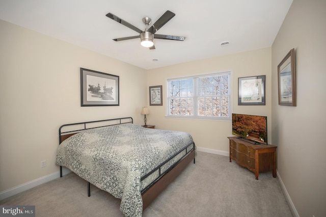 bedroom featuring ceiling fan, visible vents, baseboards, and light colored carpet