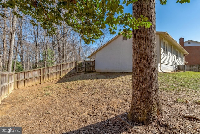 view of yard with cooling unit and a fenced backyard