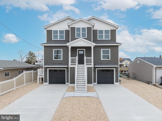 view of front of home featuring a porch and a garage