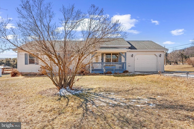 ranch-style home with a garage, a front yard, and a porch