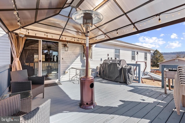 deck featuring a gazebo and grilling area