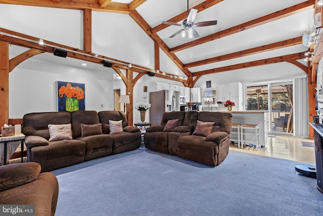 living room with ceiling fan, beam ceiling, high vaulted ceiling, and carpet