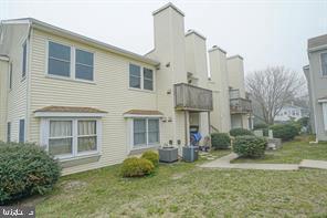 504 Skyline Condos, Pleasantville, NJ 08232 - rear view of house featuring a yard