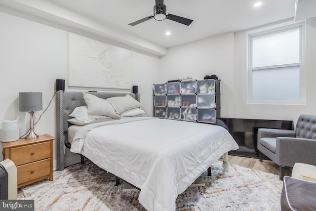 bedroom featuring ceiling fan and light hardwood / wood-style flooring