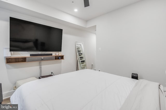 bedroom with hardwood / wood-style floors and ceiling fan