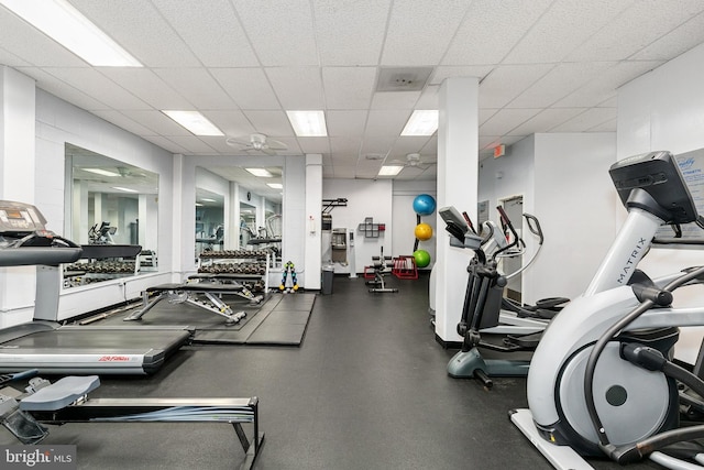 workout area featuring a drop ceiling